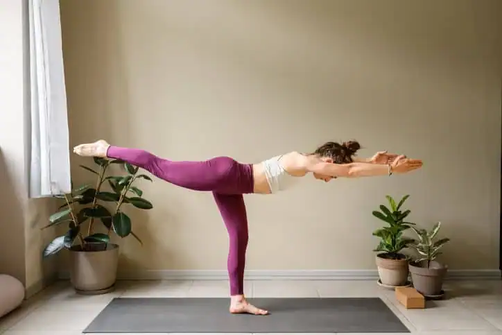 Achieving the Perfect Tone: How Often Should You Exercise for Results? 1 Woman doing Yoga exercise Royal Leamington Spa to help with toning the body.