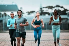 Sculpting Sleek Arms: The Essential Role of Cardio in Toning Without Bulking Up 3 image of people running to incorporate cardio Royal Leamington Spa exercise into their life to help tone arms and body.
